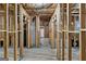 Unfinished basement with framed walls and walkout to backyard at 5760 Winding Lakes Dr, Cumming, GA 30028