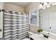 Bathroom featuring wood vanity and striped shower curtain at 5760 Winding Lakes Dr, Cumming, GA 30028