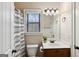Bathroom featuring a single vanity and a shower and bathtub combo at 5760 Winding Lakes Dr, Cumming, GA 30028