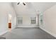 Bright bedroom featuring plush carpeting, neutral walls, and plenty of natural light from multiple windows at 5760 Winding Lakes Dr, Cumming, GA 30028