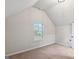Bright bedroom featuring neutral paint, carpet, and a window offering natural light at 5760 Winding Lakes Dr, Cumming, GA 30028