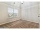 Bedroom features plush carpet, neutral walls, vaulted ceilings, and a large bright window at 5760 Winding Lakes Dr, Cumming, GA 30028