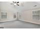 Spacious bedroom illuminated by a modern ceiling fan and natural light streaming through large windows at 5760 Winding Lakes Dr, Cumming, GA 30028