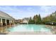 A beautiful community pool with a covered pavilion and playground for residents to enjoy at 5760 Winding Lakes Dr, Cumming, GA 30028