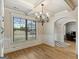 Bright dining room featuring hardwood floors, large windows, and elegant trim at 5760 Winding Lakes Dr, Cumming, GA 30028
