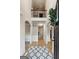 Inviting foyer with a two-story entrance, hardwood floors, and a decorative wreath at 5760 Winding Lakes Dr, Cumming, GA 30028