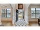 Open foyer with natural light, hardwood floors, and a view to the front yard at 5760 Winding Lakes Dr, Cumming, GA 30028