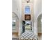 Grand foyer showcasing high ceilings, arched doorways, and a view to the outdoors at 5760 Winding Lakes Dr, Cumming, GA 30028