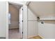 Hallway leading to bedroom with open door and adjacent closet at 5760 Winding Lakes Dr, Cumming, GA 30028