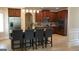 Spacious kitchen with an island, granite countertops, stainless steel appliances, and hardwood floors at 5760 Winding Lakes Dr, Cumming, GA 30028