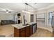 Modern kitchen with stainless steel appliances, granite countertops, a center island, and an open floor plan at 5760 Winding Lakes Dr, Cumming, GA 30028