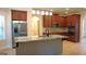 Well-equipped kitchen featuring stainless steel appliances, granite countertops, and ample cabinet space at 5760 Winding Lakes Dr, Cumming, GA 30028