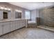 Beautiful bathroom with double vanity, soaking tub, walk-in shower, and tiled floors at 4979 Snook Thompson Se Rd, Oxford, GA 30054