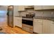 Kitchen with stainless steel appliances, granite countertops, and ample cabinetry at 4979 Snook Thompson Se Rd, Oxford, GA 30054