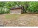 View of a wooden shed in the backyard at 4979 Snook Thompson Se Rd, Oxford, GA 30054
