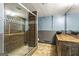 Modern bathroom featuring a glass-enclosed shower and stylish vanity with a vessel sink at 3863 Dundee Ne Dr, Roswell, GA 30075
