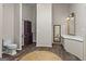 Bathroom with unique floors has closet, toilet, and vanity with good lighting and plenty of room at 3863 Dundee Ne Dr, Roswell, GA 30075