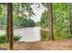 Beautiful lake view framed by trees, offering a serene and natural setting at 3863 Dundee Ne Dr, Roswell, GA 30075