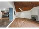 Spacious living room with hardwood floors, wooden ceiling and stone fireplace at 3863 Dundee Ne Dr, Roswell, GA 30075