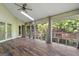 Bright sunroom boasts large windows with scenic views, creating a serene and inviting atmosphere at 3863 Dundee Ne Dr, Roswell, GA 30075