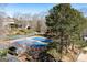 Community tennis courts feature blue courts, covered seating, and beautiful landscaping at 3863 Dundee Ne Dr, Roswell, GA 30075