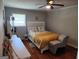 Comfortable bedroom with wood floors and natural light from the window at 3969 W Hilda Cir, Decatur, GA 30035