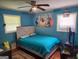 Bright bedroom featuring wood floors and a ceiling fan for added comfort at 3969 W Hilda Cir, Decatur, GA 30035