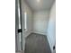 A walk-in closet featuring white wire shelving and neutral carpet at 222 Silvercrest Dr # 153, Acworth, GA 30101