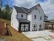 Stylish two-story home with a three-car garage and a beautifully landscaped yard at 222 Silvercrest Dr # 153, Acworth, GA 30101