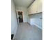 Laundry room with white cabinets and countertop at 222 Silvercrest Dr # 153, Acworth, GA 30101