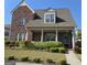 Charming brick home with a covered porch and well-manicured landscaping at 101 Eadestowne Way, Peachtree City, GA 30269