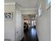 Bright hallway leading to an open-concept kitchen and dining area at 101 Eadestowne Way, Peachtree City, GA 30269