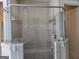 Modern shower featuring stone tile and seamless glass enclosure at 101 Eadestowne Way, Peachtree City, GA 30269