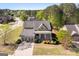 A sunny aerial view of a house with a landscaped front yard at 237 Highcrest Dr, Acworth, GA 30101