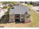 Overhead view of the back of the house with outdoor deck and grassy yard at 237 Highcrest Dr, Acworth, GA 30101
