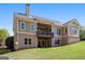 The rear exterior shows a house with an upper and lower deck at 237 Highcrest Dr, Acworth, GA 30101