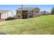 View of the backyard showing a large grassy area at 237 Highcrest Dr, Acworth, GA 30101