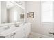 Bright bathroom featuring a double vanity, framed mirror, and neutral finishes offers a functional and stylish space at 237 Highcrest Dr, Acworth, GA 30101
