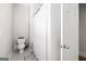 Neutral bathroom with a toilet, shower, and white door at 237 Highcrest Dr, Acworth, GA 30101