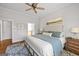 Stylish bedroom featuring a luxurious bed, ceiling fan, and picturesque artwork offers a tranquil and elegant retreat at 237 Highcrest Dr, Acworth, GA 30101