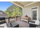 Inviting outdoor deck with seating, grill, and wooded backdrop is the perfect place to unwind and enjoy the outdoors at 237 Highcrest Dr, Acworth, GA 30101