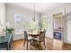 Bright dining room with wood floors, wainscotting, and access to the outdoor patio at 237 Highcrest Dr, Acworth, GA 30101