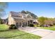 Charming home exterior with a three car garage and well-manicured lawn at 237 Highcrest Dr, Acworth, GA 30101