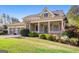 Attractive home with a welcoming front porch, a well-manicured lawn, and beautiful landscaping at 237 Highcrest Dr, Acworth, GA 30101