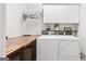 Functional laundry room with washer, dryer, and folding counter offers convenience and efficiency in household tasks at 237 Highcrest Dr, Acworth, GA 30101