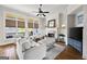 Cozy living room featuring a fireplace, large windows, and comfortable seating at 237 Highcrest Dr, Acworth, GA 30101