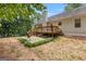 Nice backyard featuring a spacious wooden deck and concrete patio, great for gatherings and barbecues at 372 River Point Dr, Mcdonough, GA 30252