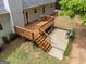 Aerial view of the home's backyard deck and patio, perfect for outdoor relaxation and entertaining at 372 River Point Dr, Mcdonough, GA 30252