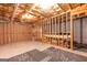 Unfinished basement with exposed framing and insulation ready for customization and expansion at 372 River Point Dr, Mcdonough, GA 30252