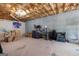 Unfinished basement featuring carpet, storage and an exposed ceiling at 372 River Point Dr, Mcdonough, GA 30252